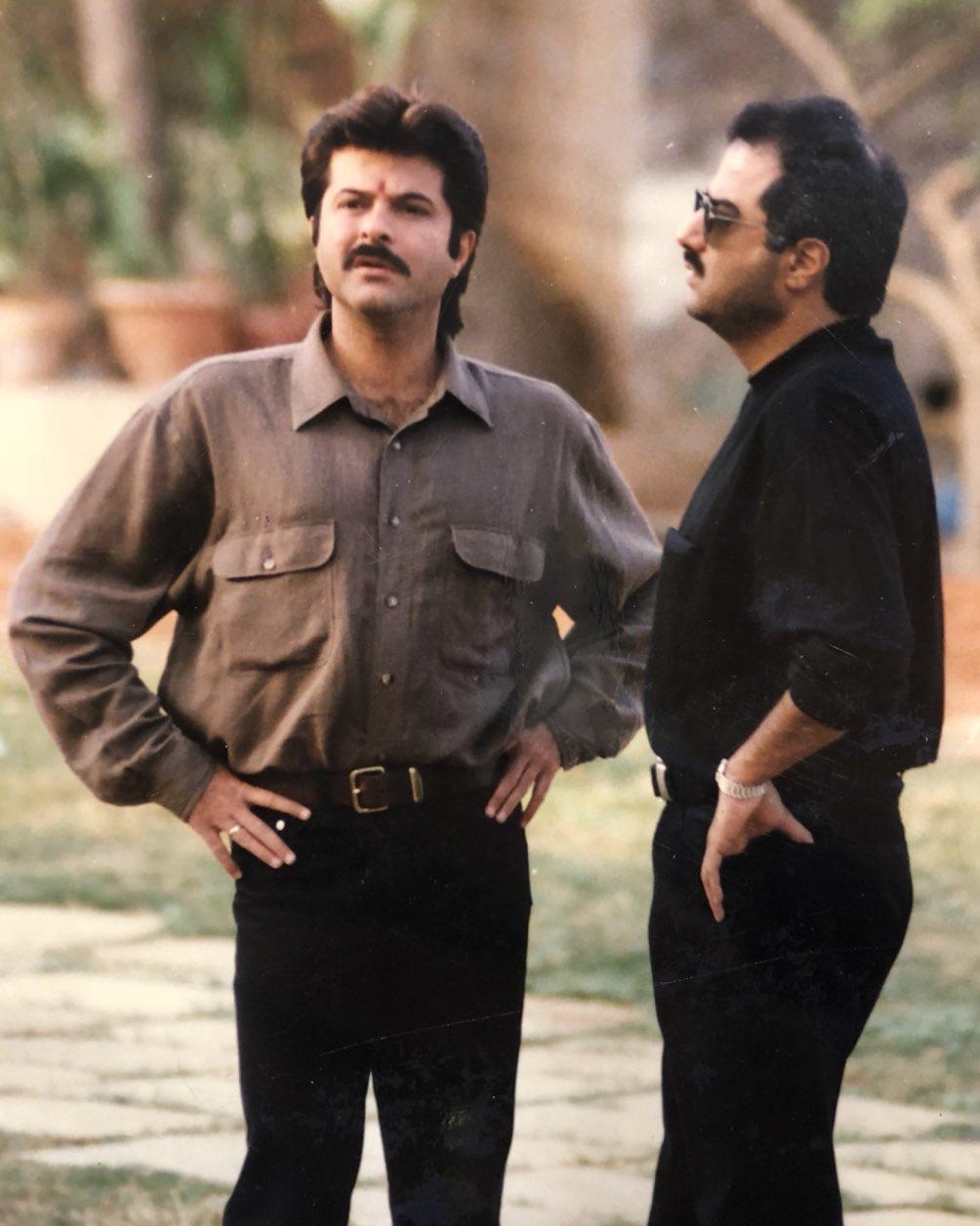 Swag runs in the family! Caught in a candid moment, Boney Kapoor and Anil Kapoor are seen having a conversation probably on the sets of a film