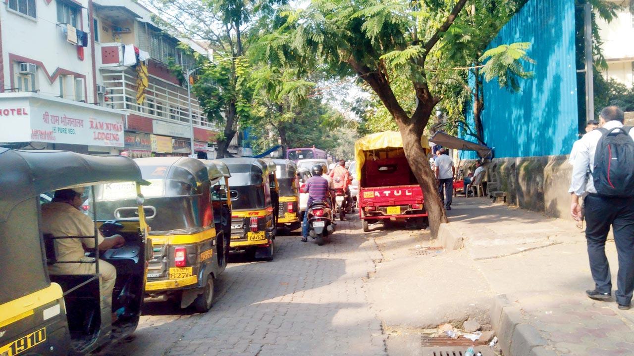A tempo (in red) is illegally parked on the New Nagardas Road that leads to the Andheri subway, on Monday
