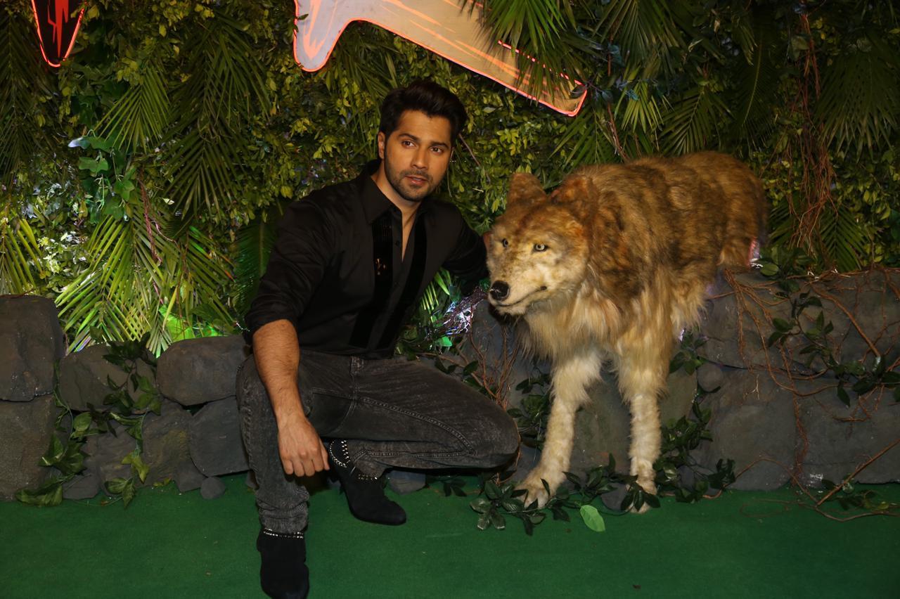 Varun Dhawan who will be seen as a werewolf in the film is seen posing with a wolf model at the screening