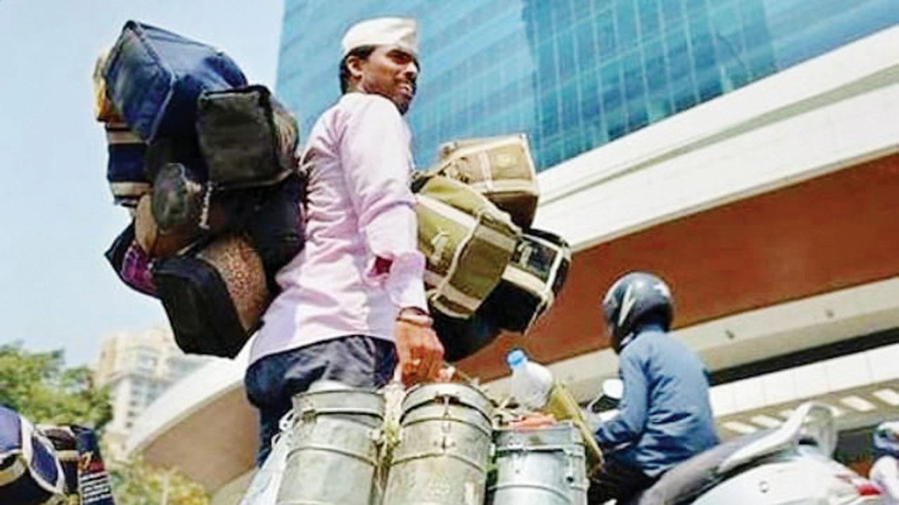  Dabbawalas on their way. Pic Courtesy/@mumbai_dabbawala