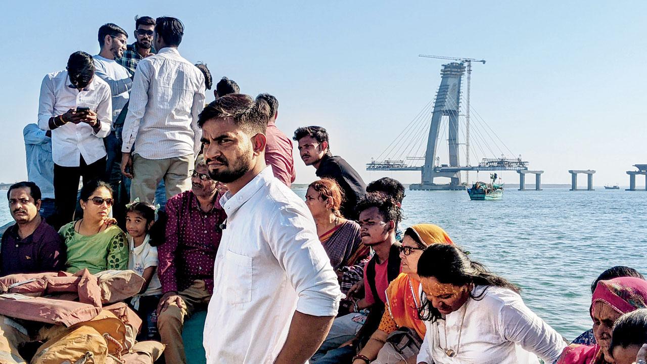 A passenger ferry passes by the under-construction sea link between Okha and Bet Dwarka. Once ready, it will reduce the dependence on boats for the journey. Pics/Dharmendra Jore