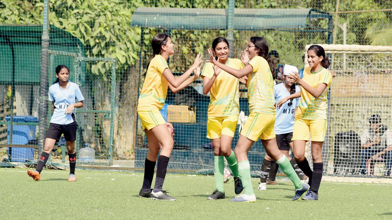 Bombay International’s Reinaa Mehta (second from left) celebrates after scoring against defending champions Mary Immaculate Girls (MIG) during a group stage match of mid-day’s Ranis of Rink U-16  inter-school football tournament at the Neville D’Souza Turf in Bandra on Friday