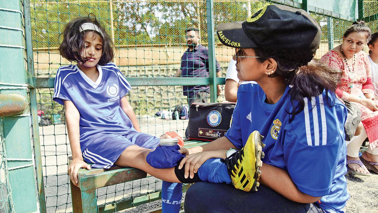 Physio Kimberley Coutinho treats a Dhirubhai Ambani player