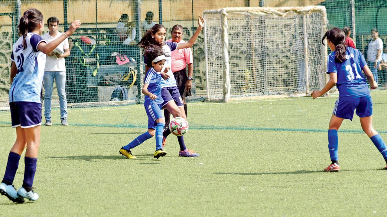 Dhirubhai Ambani’s Mahika Praveen (second from left) vies for the ball with Zia Shah of Bombay Scottish (Mahim) during a group stage match of the mid-day’s Ranis of Rink tournament in Bandra on Friday