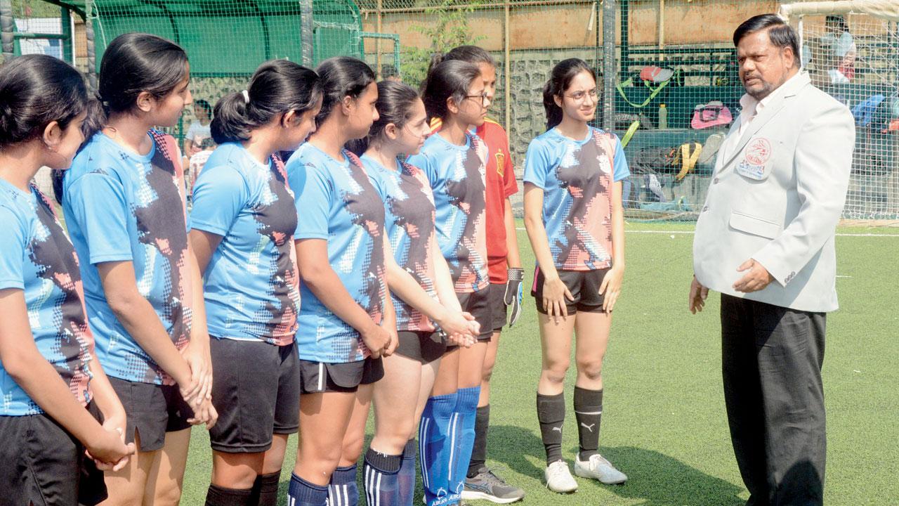 Mumbai Schools Sports Association president Fr Jude Rodrigues gives a pep talk to AVM Bandra (West) team before their match v AVM Juhu