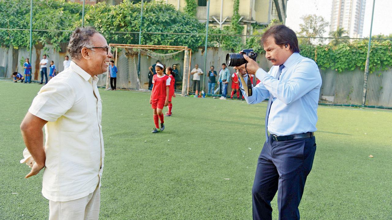 Hockey great Dhanraj Pillay turns lensman as he shoots pictures of mid-day’s principal photographer Atul Kamble on Friday