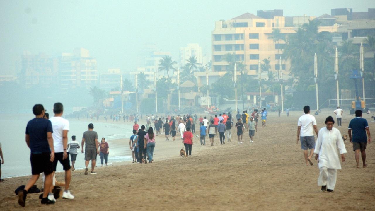 People are seen walking at Juhu beach. Pic/Satej Shinde