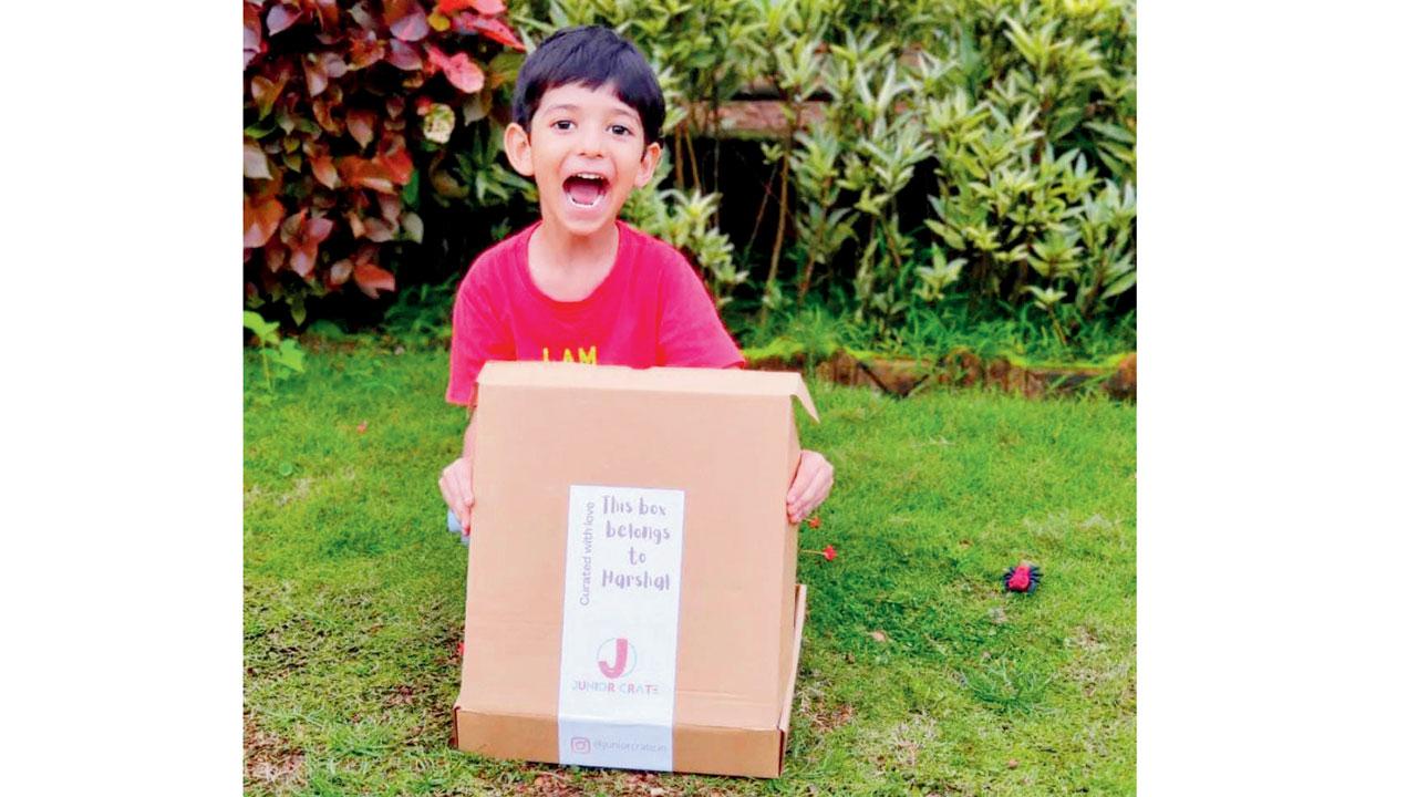A kid plays with the box