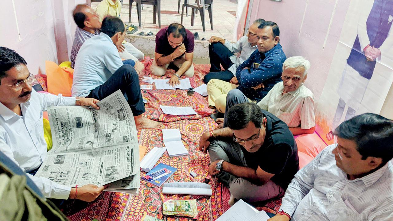 BJP workers at the party office. Mahendrabhai Ghodasra (left) and Kamleshbhai Dalsania defended the charge against the party
