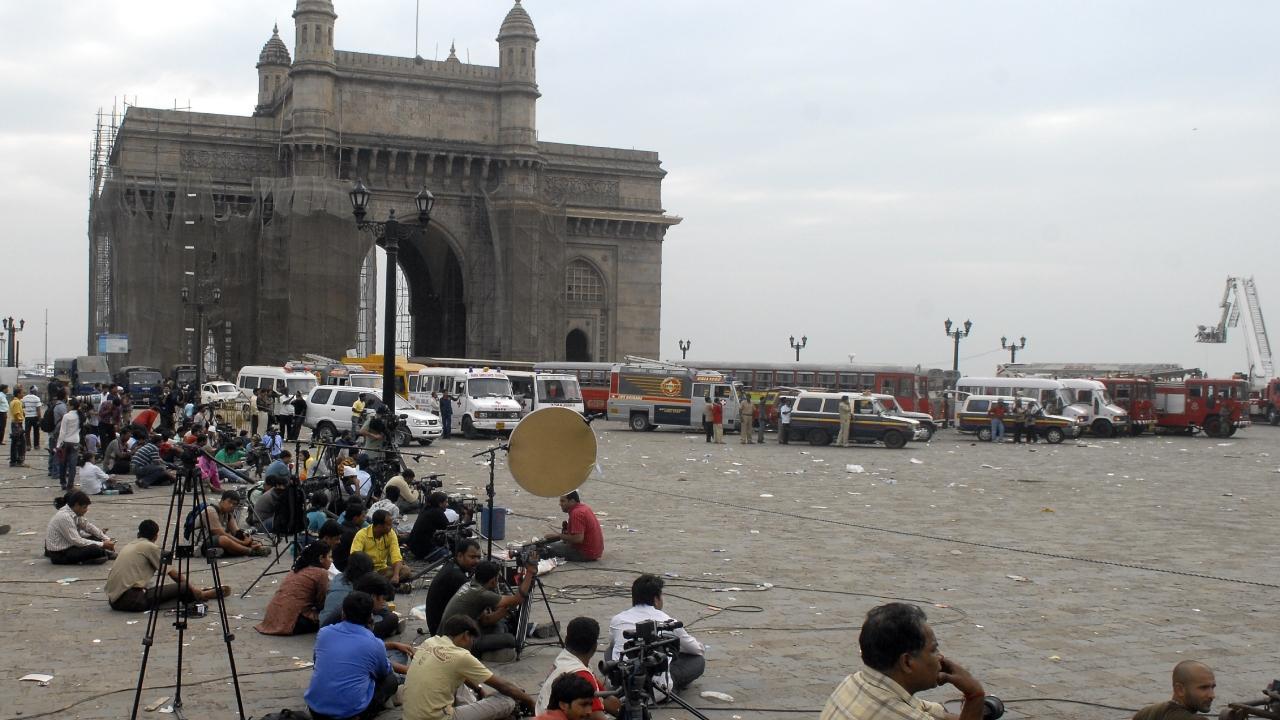 Reporters, and cameramen assembled at the Gateway of India to cover the terror attacks at Taj hotel