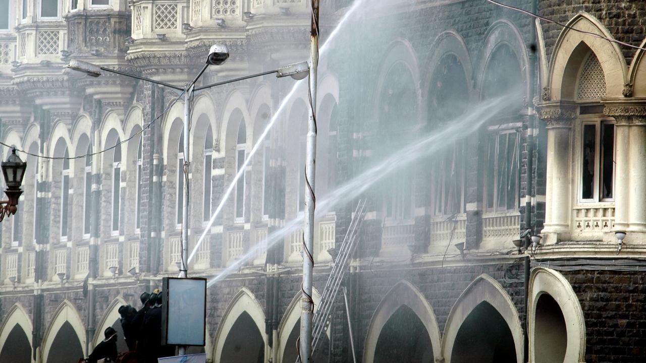 Mumbai Fire Brigade trying to extinguish the fire in the old wing of the Taj Mahal hotel