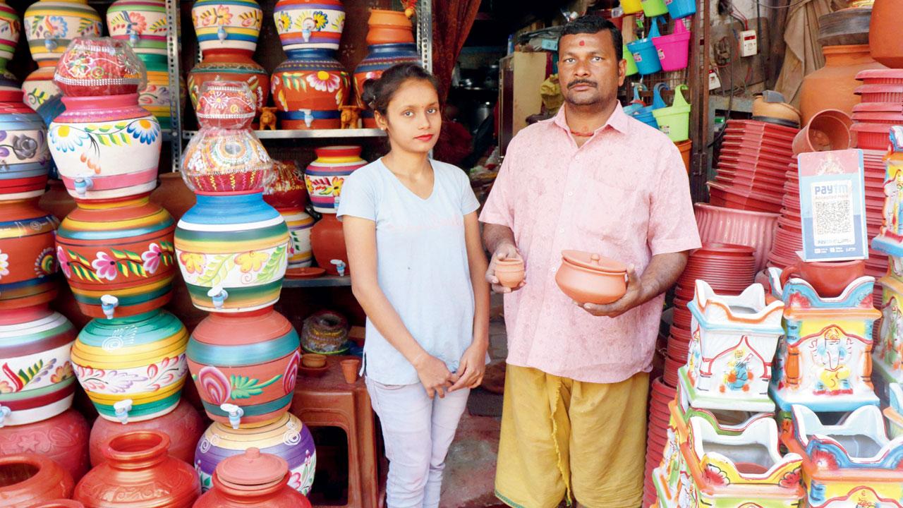 Rajkumar Gupta and his daughter at their Andheri shop where they sell clay vessels crafted at their Virar workshop. Pic/Anurag Ahire