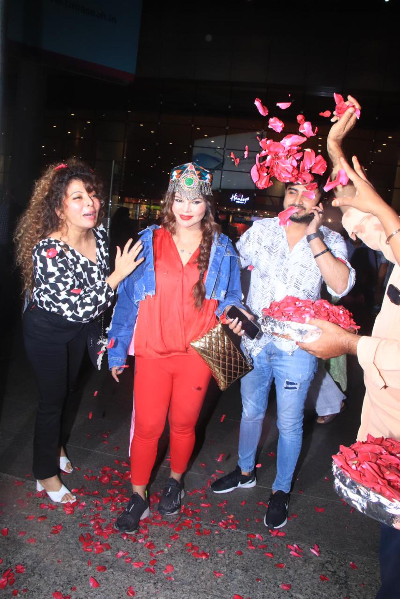 In Pics: Rakhi Sawant rings in 44th birthday at airport with boyfriend Adil  Khan