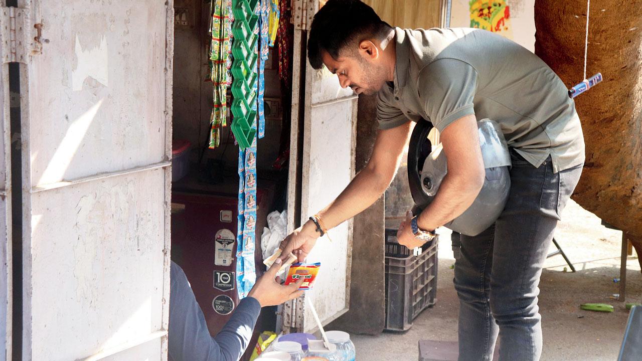 As part of the test drive, mid-day’s Suraj Pandey buys a packet of gutkha in Borivli. Pics/Anurag Ahire