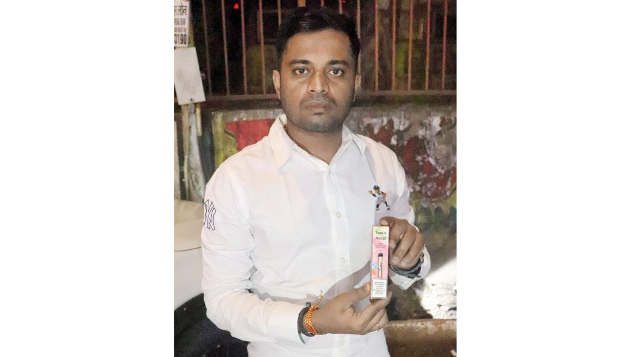mid-day correspondent Suraj Pandey with an illegal e-cigarette at a pan shop in Kandivli West. Pic/Anurag Ahire