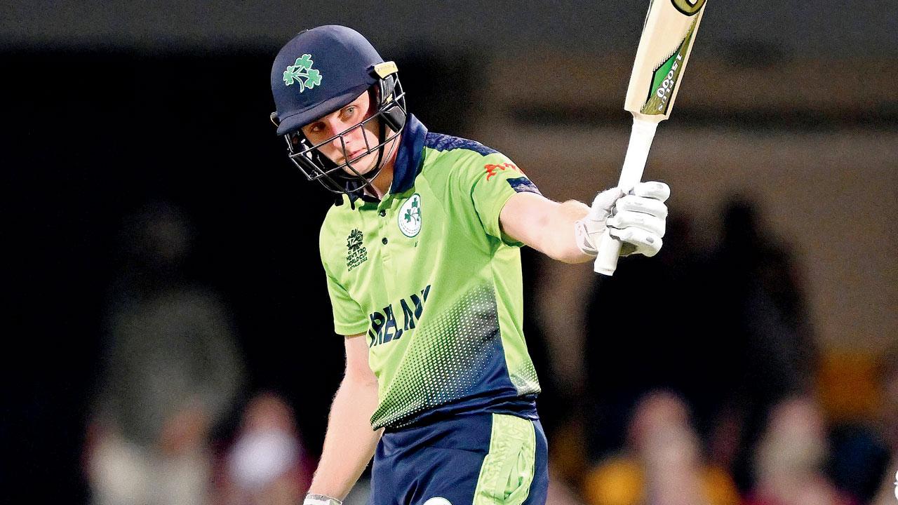 Irish batsman Lorcan Tucker celebrates his half-century