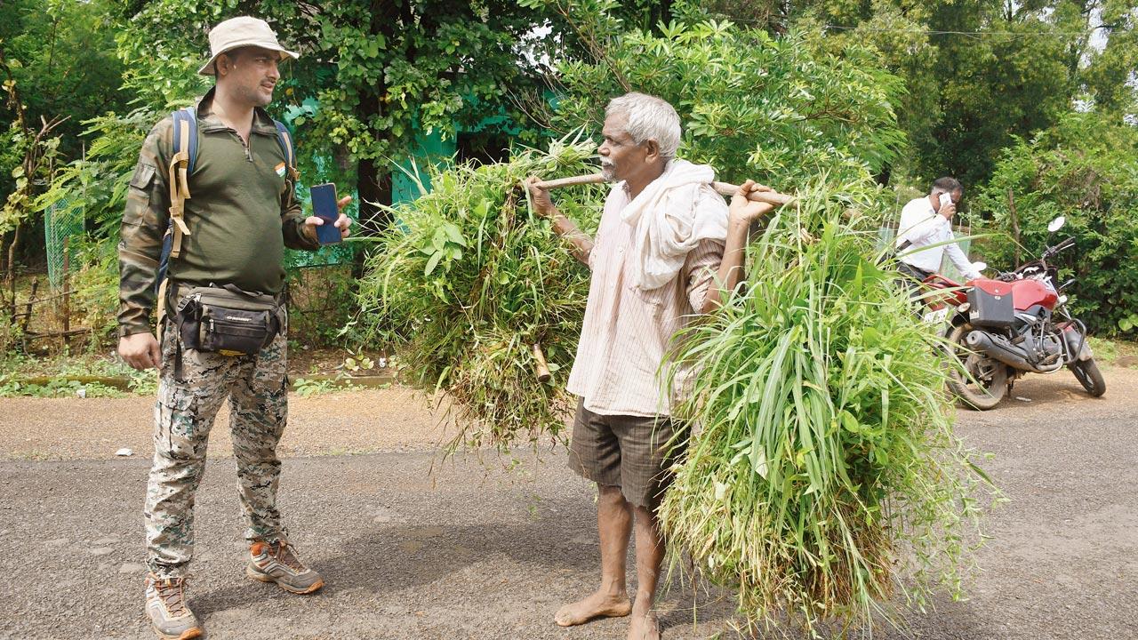 A forest officer seen cautioning a villager in Kawtha, Gondia  about the herd of elephants. Officers have been trying to educate locals, and warning them about the dangers of moving outside, post sunset. Meetings are being organised with village heads on a regular basis