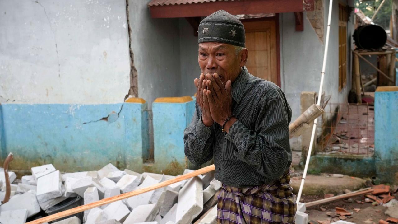 A man reacts as he inspects the damage caused by Monday's earthquake in Cianjur, West Java, Indonesia. Pic/PTI