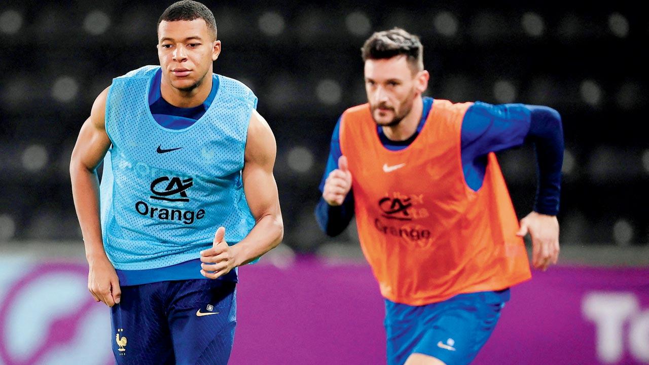 France’s Kylian Mbappe (left) and Hugo Lloris during a training session in Doha  on Sunday. Pic/AFP