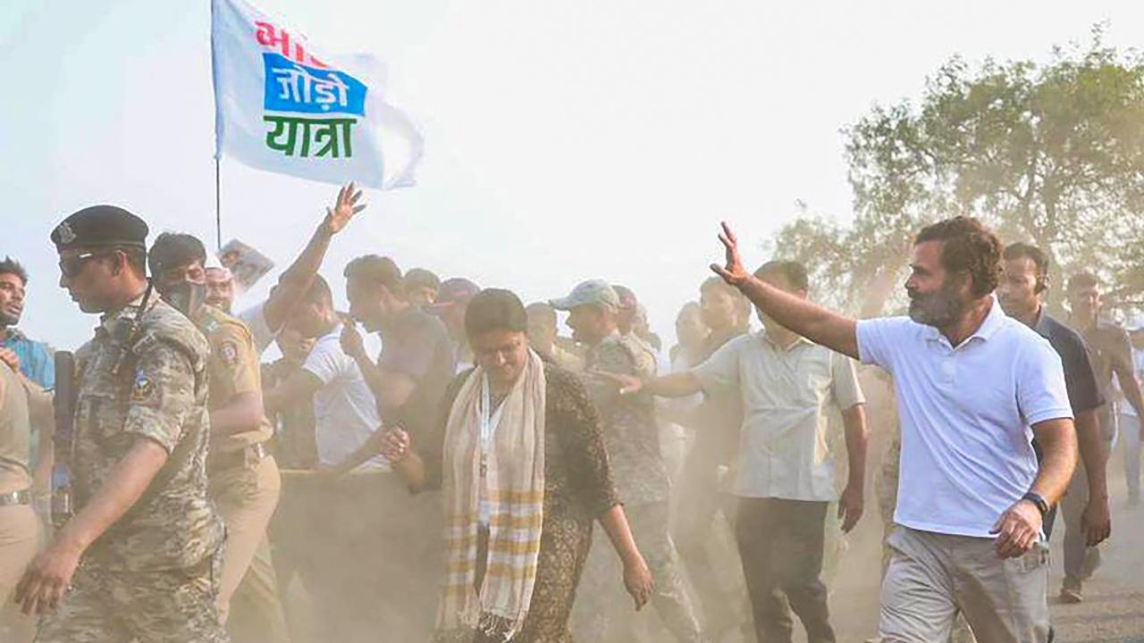 Congress leader walks with supporters in Bharat Jodo Yatra in Maharashtra. Pic/PTI