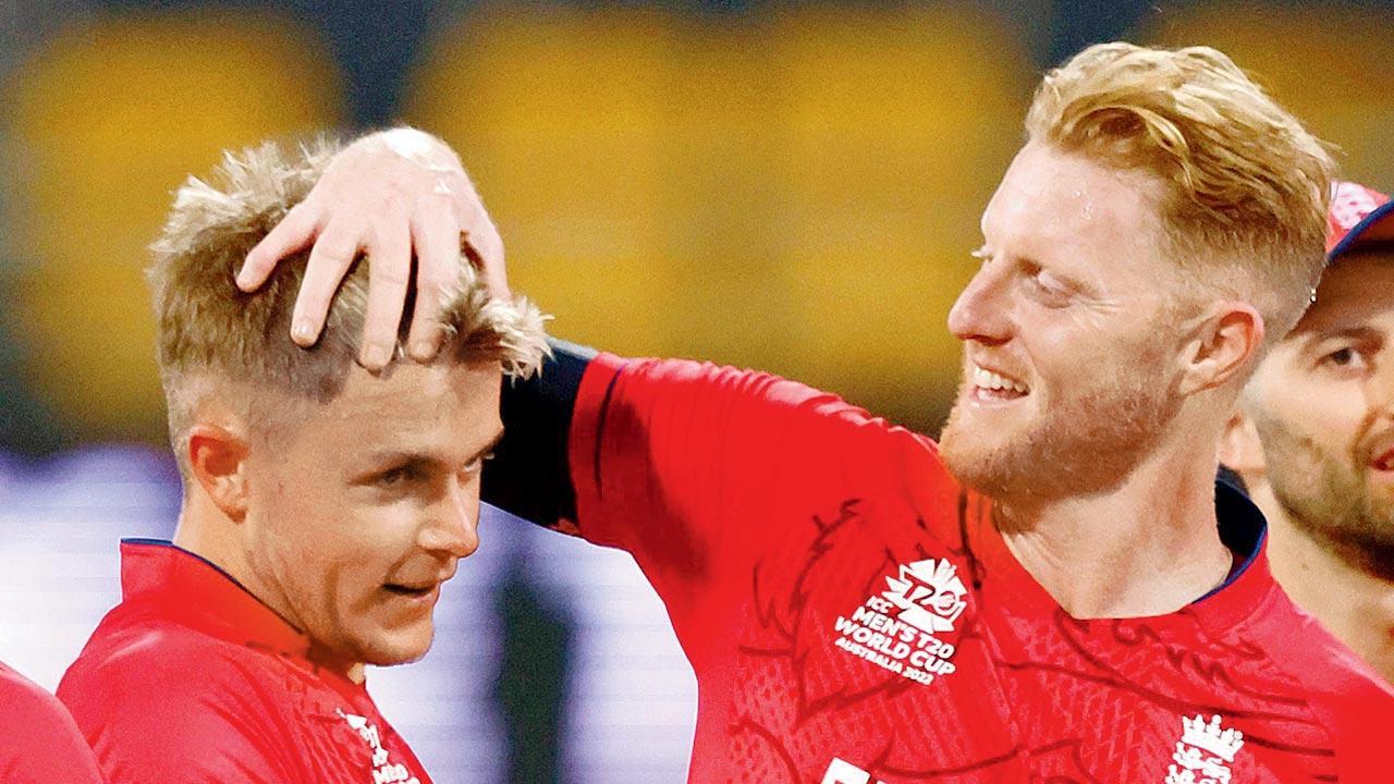 England’s Ben Stokes (right) congratulates pacer Sam Curran for taking a NZ wicket. Pics/AFP