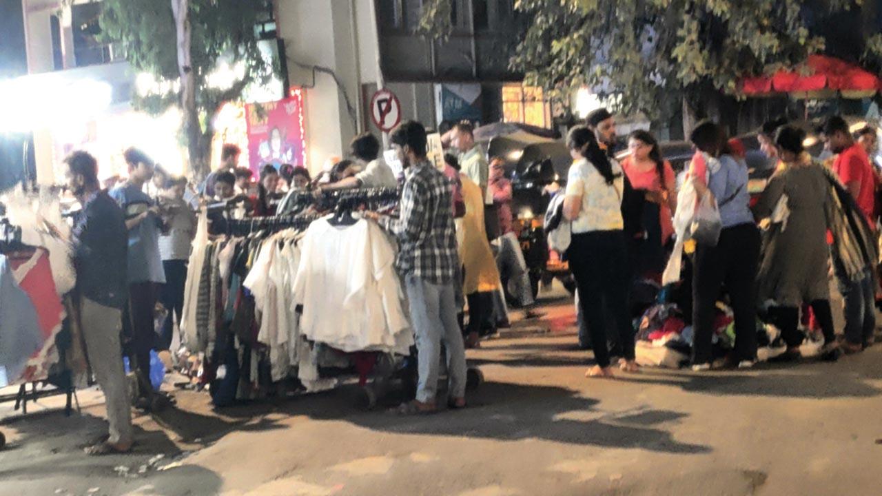 With the BMC van gone, illegal street vendors spill onto the footpath and the road