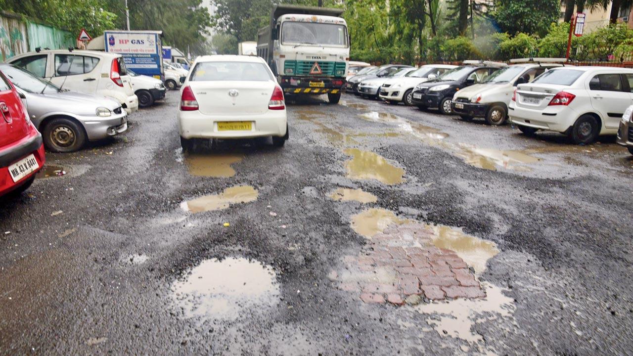 A pothole-ridden road in Pratiksha Nagar. File pic