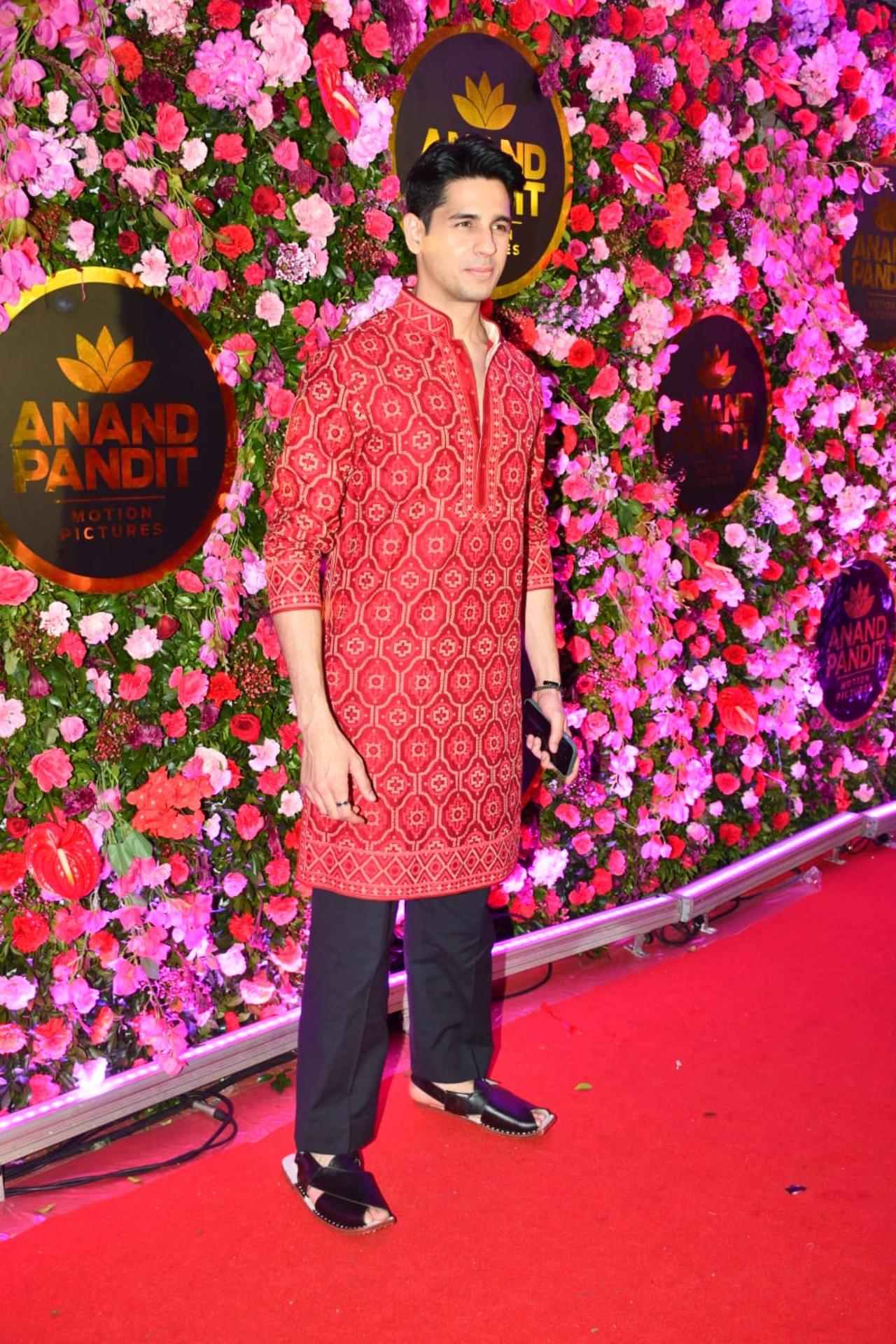 Sidharth Malhotra made a solo entry in a red kurta and black pajama for the party