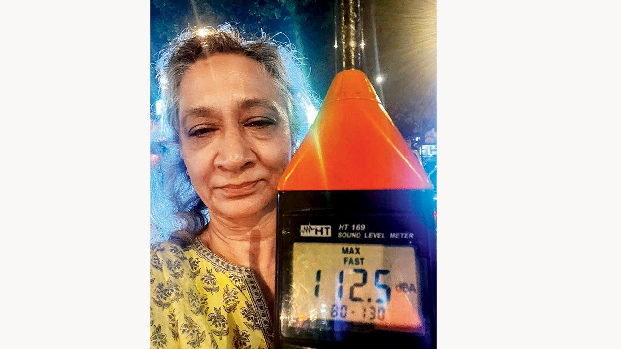 Awaaz Foundation’s Sumaira Abdulali with a sound meter during the procession