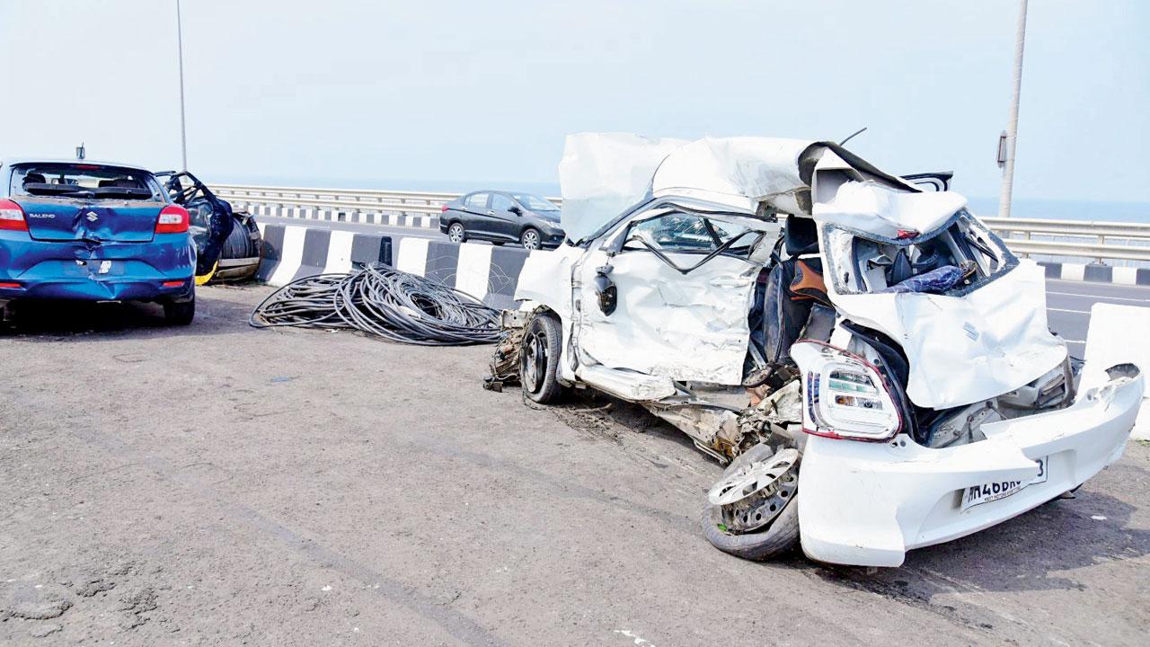 Remains of the cars and an ambulance that were hit by a speeding Hyundai late on Tuesday night, on the Bandra Worli Sea Link, on Wednesday. The Hyundai is also at the accident site. Pics/Shadab Khan