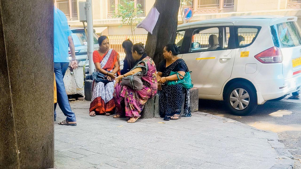 Three agents sit behind the RBI office in Fort