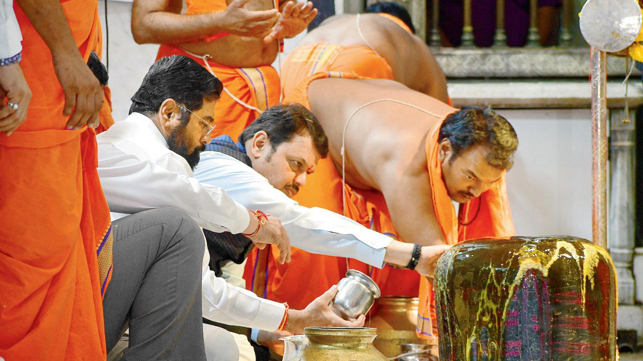 CM Eknath Shinde, Dy CM Devendra Fadnavis at Babulnath Temple on Tuesday. Pic/PTI