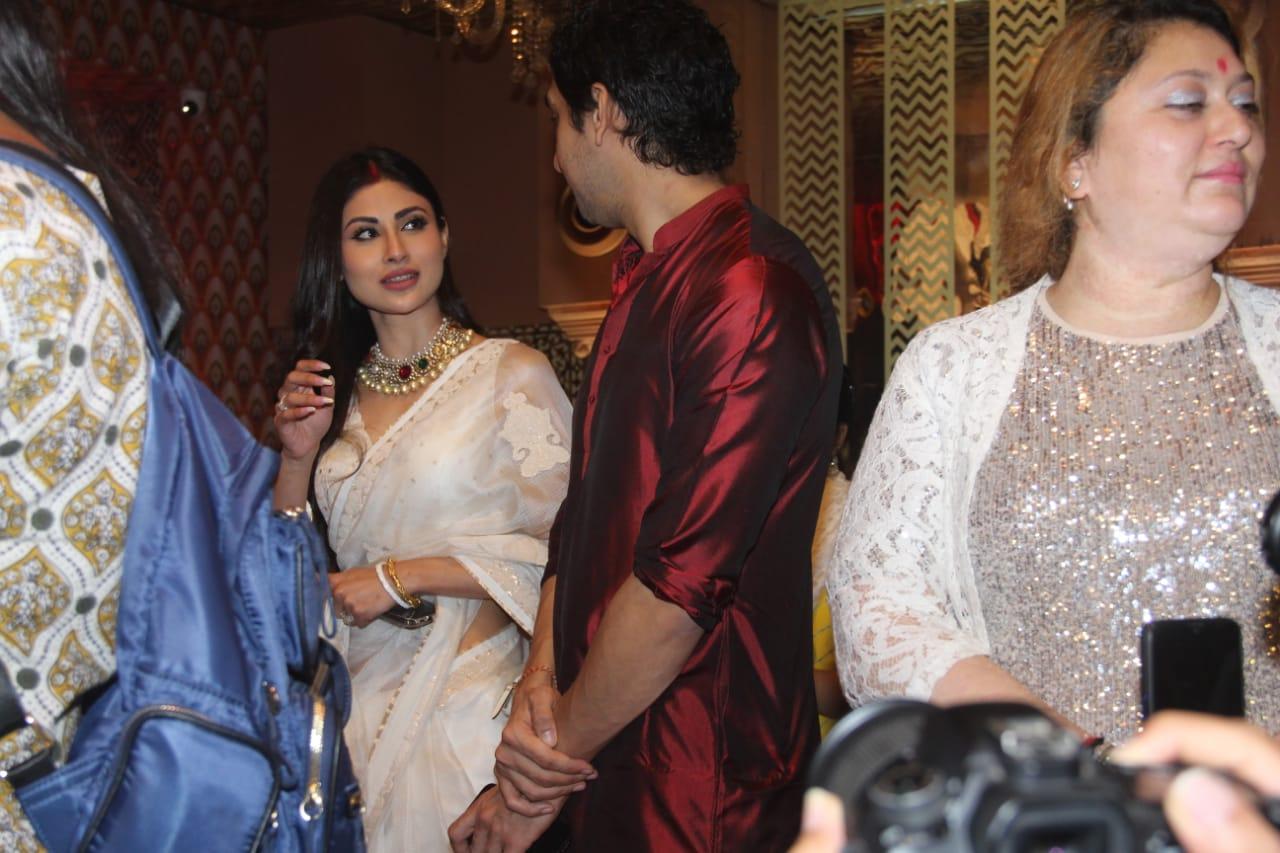 Mouni Roy was also seen visiting the pandal in Juhu. She was seen interacting with her 'Brahmastra' director Ayan Mukerji who was seen at the pandal on Sunday and Monday