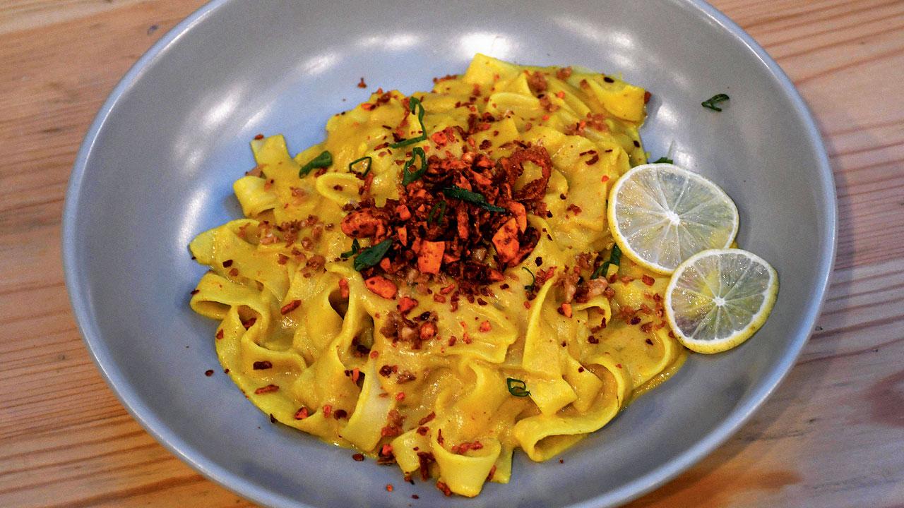 Khow suey served in fettuccine pasta