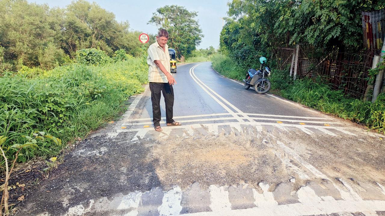 Vishnu Patel, the auto driver who rescued the youths in Monday’s accident, points to the section where speed breaker was built