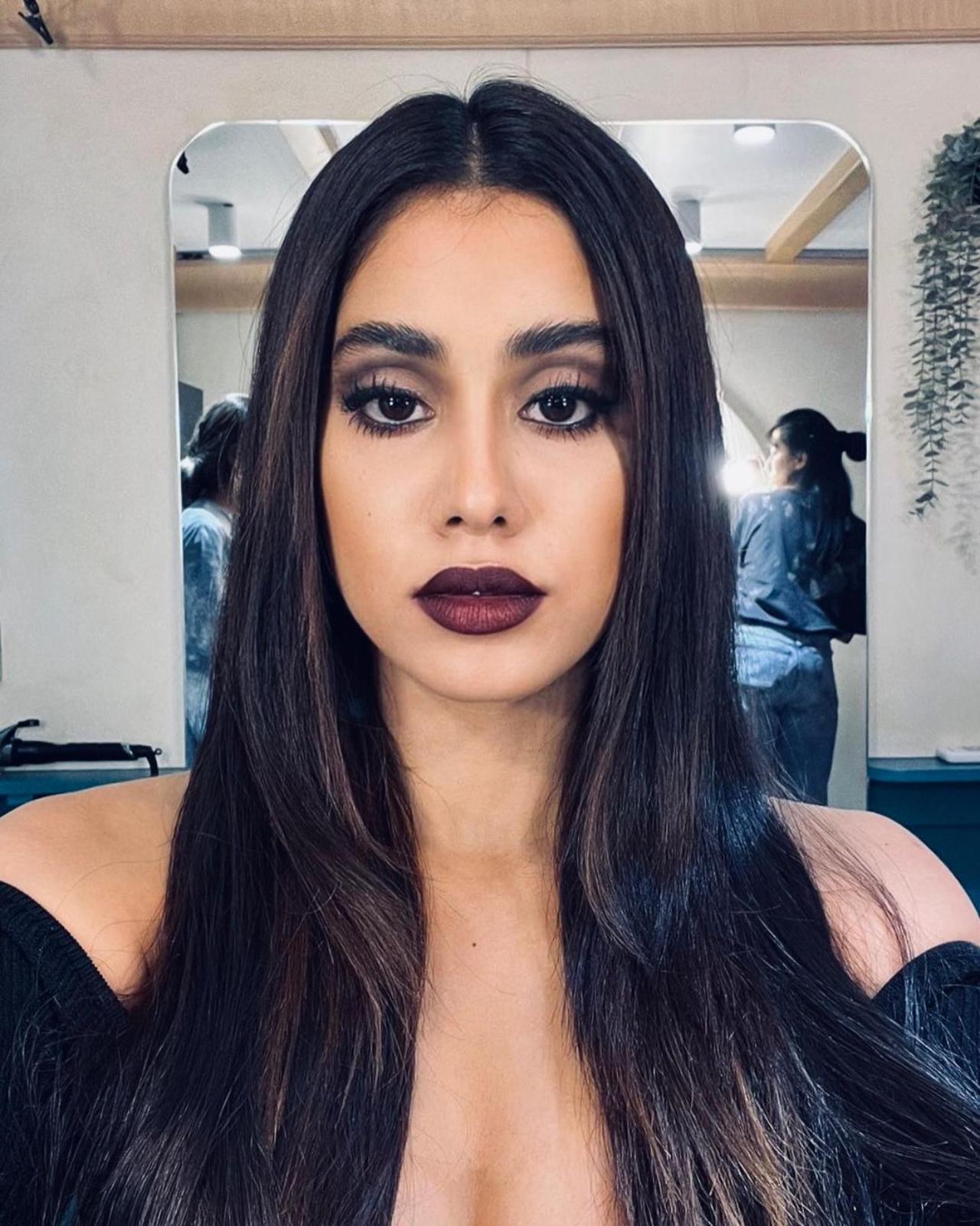 Janhvi went all bold with her make-up for the party sticking to the theme. She was dressed in a black body-hugging midi dress. She straightened her long hair and opted for dark shades of make-up for her lips and eyes