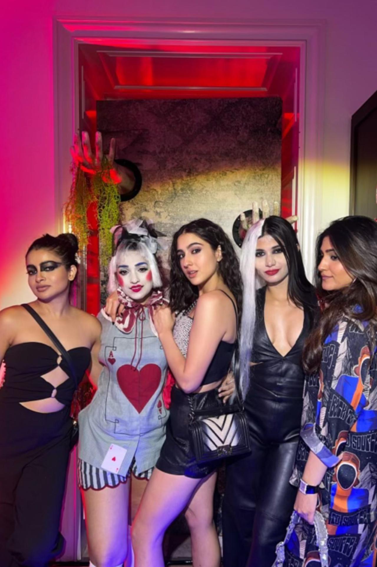 Sara Ali Khan who donned a chic look for the party posed with her team. Sara opted for a black mini skirt, printed crop top and perm hair with smoky eyes for the party