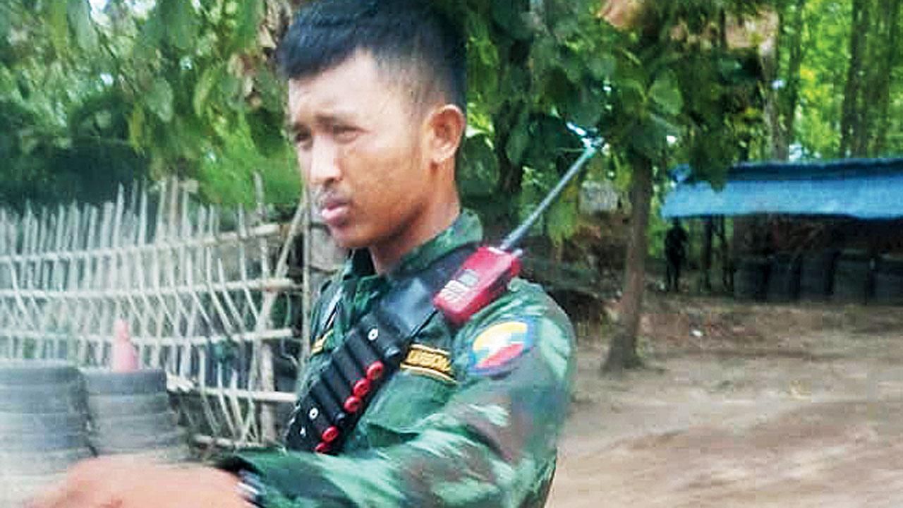 A gun-toting guard on the premises where the Indians are being forced into slavery