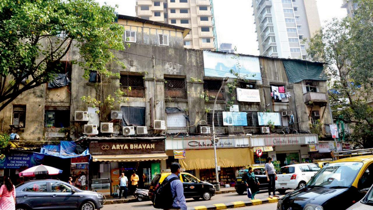 The existing buildings house many popular shops, outside Matunga station