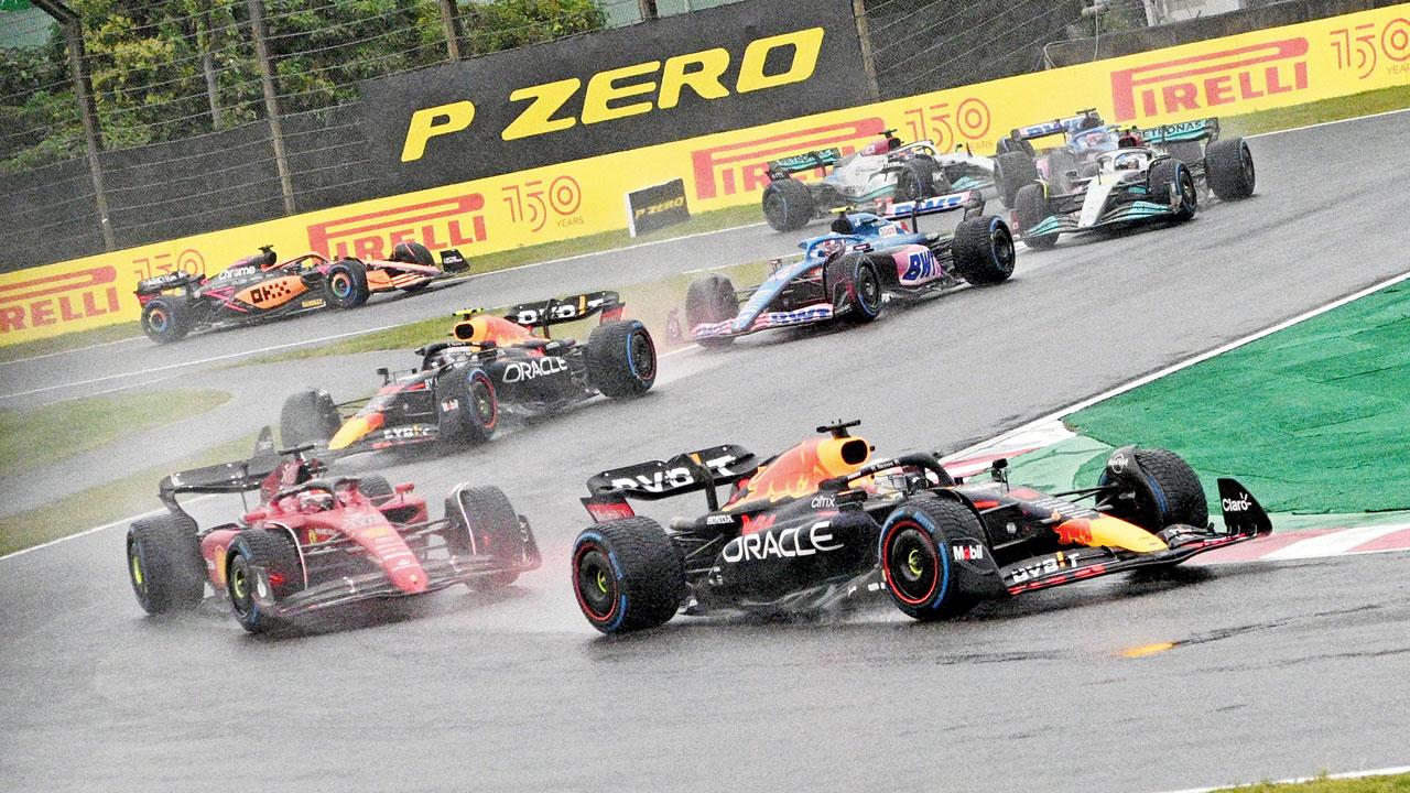 Verstappen leads the pack across the wet Suzuka track yesterday. Pic/AFP