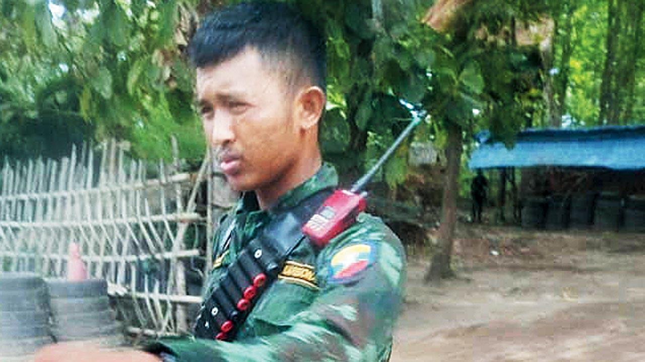 One of the armed guards on the premises where the Indians are being forced into slavery