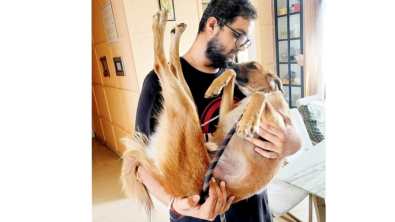 Nachiket Deshpande with a therapy dog