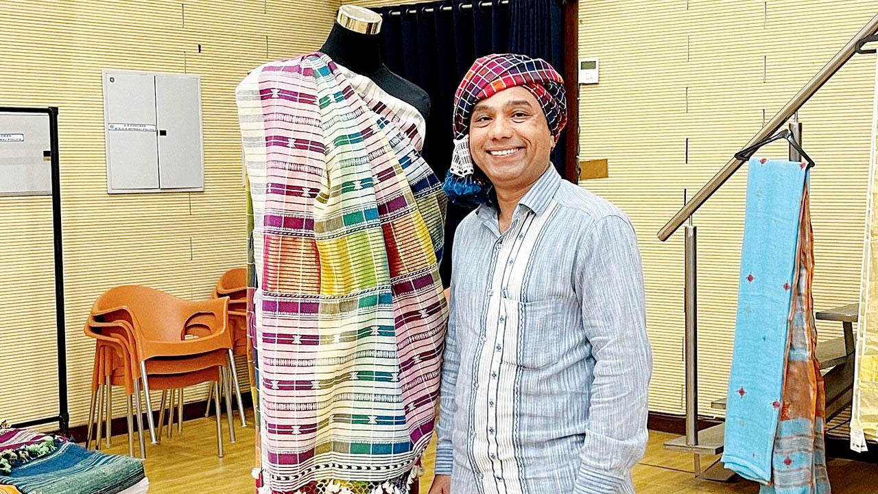 Purshottam Premji with his rainbow chequered Bhujodi saree at Design Craft