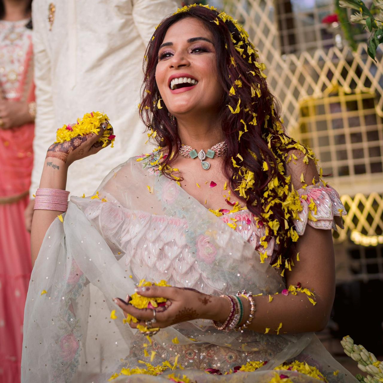  The couple did a fun “phoolon Ki holi” as their friends and family showered them in a customary way. This was followed by mehendi for Richa and her friends in a colorful set up