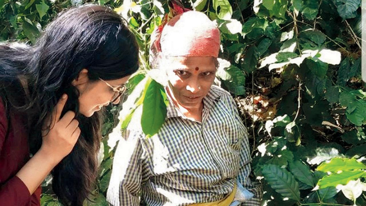 Jain with a coffee plantation worker