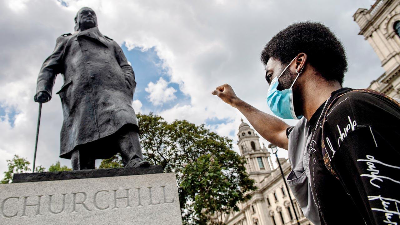 A protester raises his fist next to a statue of Winston Churchill in Parliament Square during a Black Lives Matter demonstration on June 20, 2020 in London. Journalist Shrabani Basu feels Sunak’s biggest challenge would be not to pander to right wingers. “[In the last two years] there has been an unfortunate move towards ‘culture wars’ rather than cultural unity. The Black Lives Matter movement brought these issues to the fore. A criticism of the legacy of [former PM Winston] Churchill, led to right-wing protesters marching to London to defend the statue of Churchill, when no one had even threatened it... many of the right wing in the Conservative Party who fuelled the ‘culture wars’”