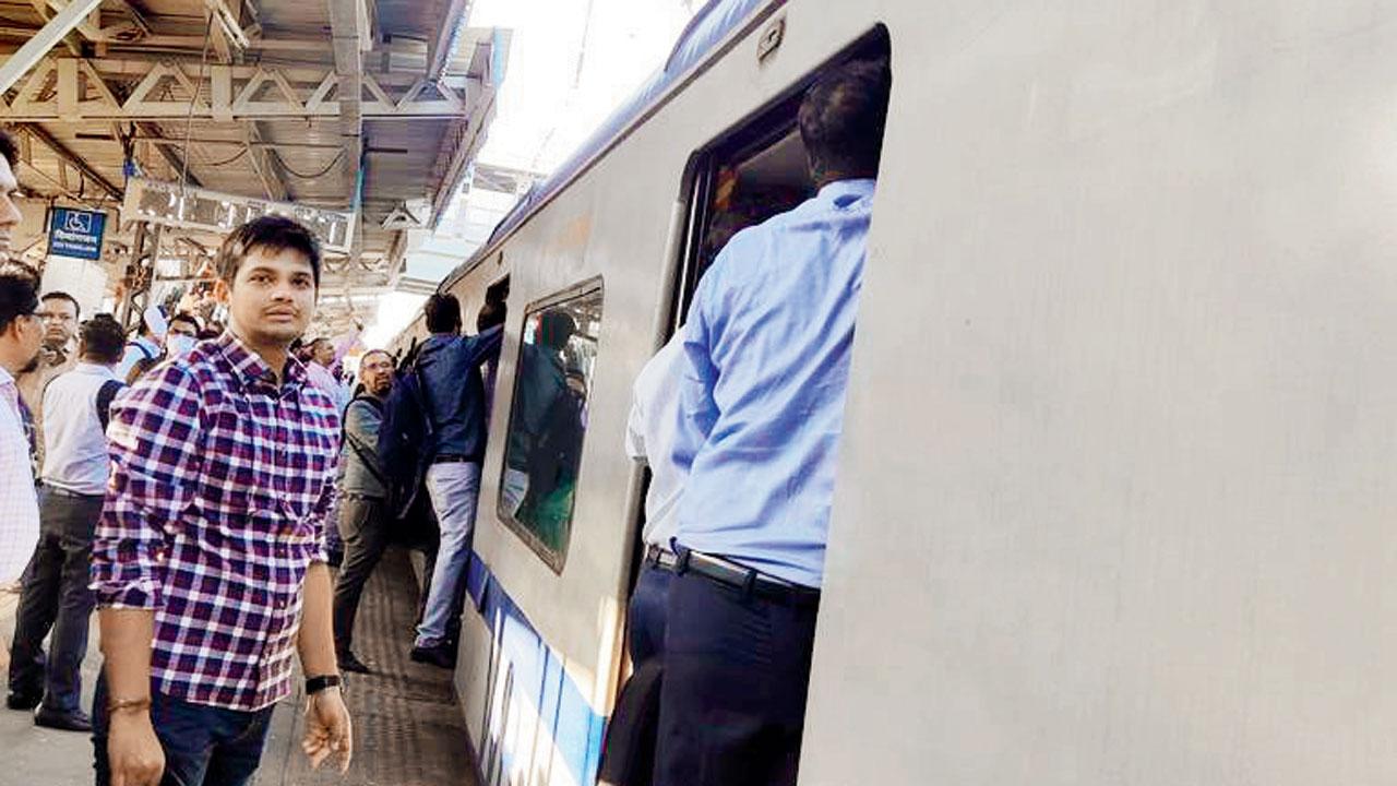 Commuters are hassled, as new timetable leads to overcrowding, at Mira Road station on Western Railway, on Monday morning