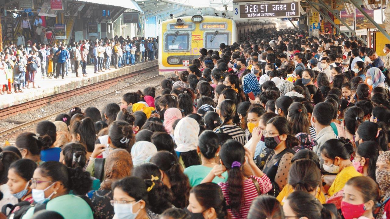Commuters wait to board a local at Dombivli station, on February 5. Pic/Satej Shinde	