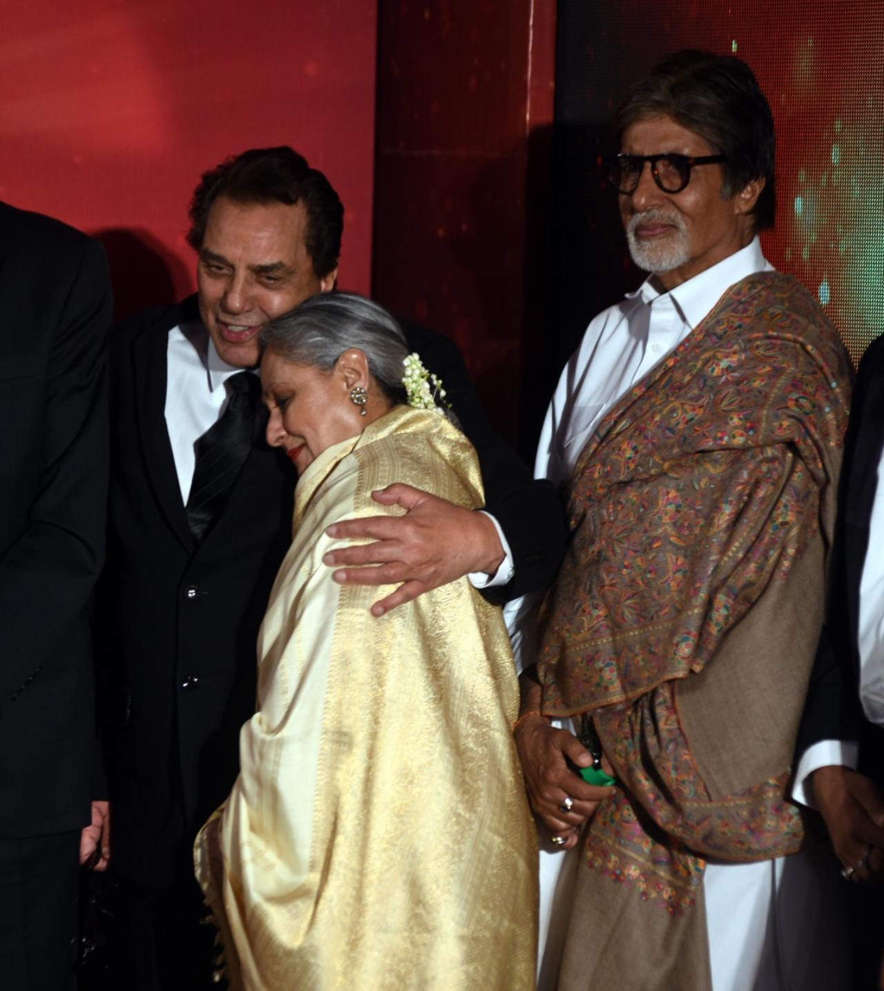 The Sholay trio have a warm reunion at an event. Jaya Bachchan gives a hug to her co-star as Amitabh Bachchan looks on