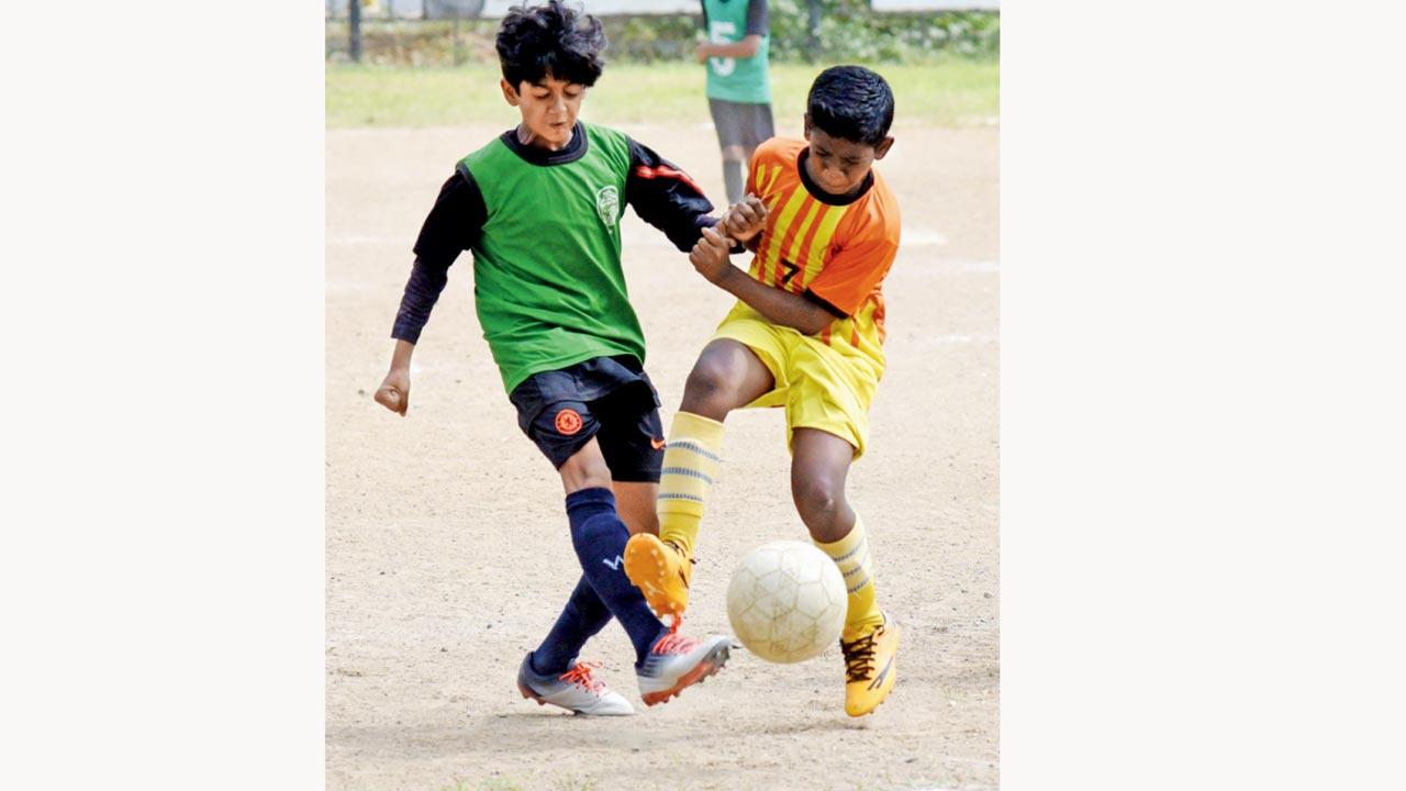 Utpal Shanghvi’s hat-trick hero Ayaansh Mathur Savio (left) makes a tackle. Pic/Sameer Markande
